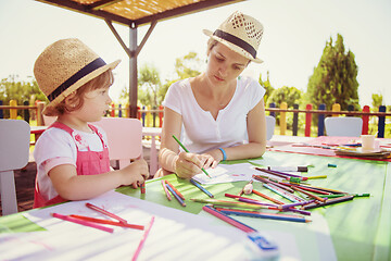 Image showing mom and little daughter drawing a colorful pictures