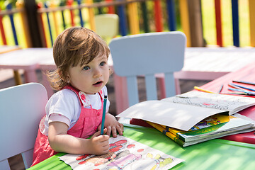 Image showing little girl drawing a colorful pictures