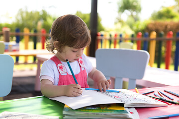 Image showing little girl drawing a colorful pictures