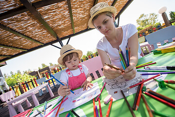 Image showing mom and little daughter drawing a colorful pictures