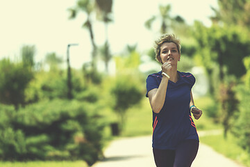 Image showing young female runner training for marathon