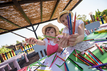 Image showing mom and little daughter drawing a colorful pictures