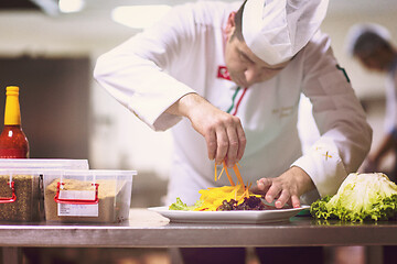 Image showing chef serving vegetable salad