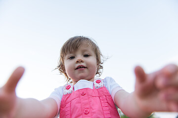 Image showing little girl spending time at backyard