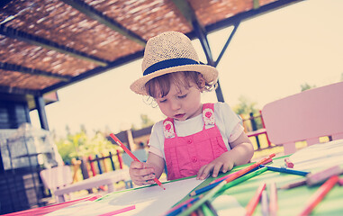 Image showing little girl drawing a colorful pictures