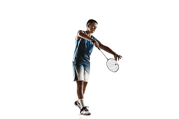 Image showing Little boy playing badminton isolated on white studio background