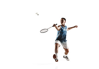 Image showing Little boy playing badminton isolated on white studio background