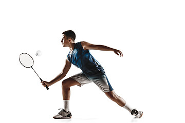 Image showing Little boy playing badminton isolated on white studio background