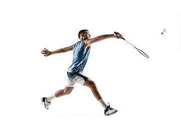 Image showing Little boy playing badminton isolated on white studio background