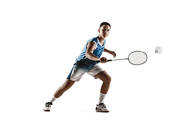 Image showing Little boy playing badminton isolated on white studio background