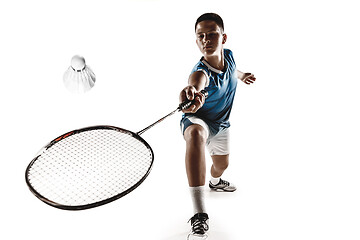 Image showing Little boy playing badminton isolated on white studio background