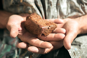 Image showing Male beggar hands seeking food or money at public path way