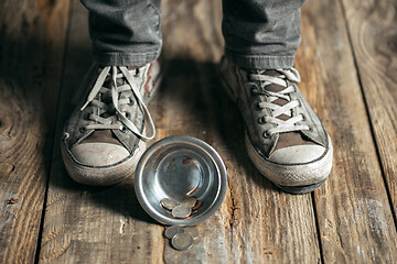 Image showing Male beggar hands seeking food or money at public path way