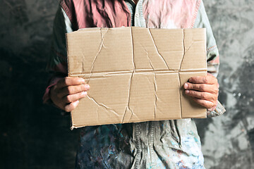 Image showing Male beggar hands seeking food or money at public path way