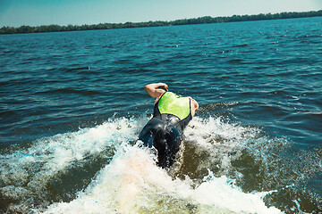 Image showing Professional triathlete swimming in river\'s open water