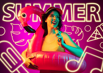 Image showing Beautiful girl isolated on studio background in neon light