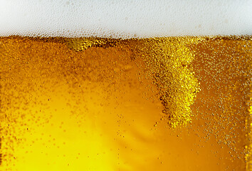 Image showing Close up view of floating bubbles in light beer texture