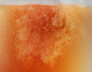 Image showing Close up view of floating bubbles in unfiltered beer texture