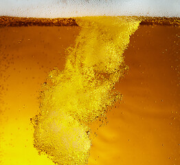 Image showing Close up view of floating bubbles in light beer texture