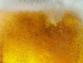 Image showing Close up view of floating bubbles in light beer texture