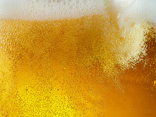 Image showing Close up view of floating bubbles in light beer texture