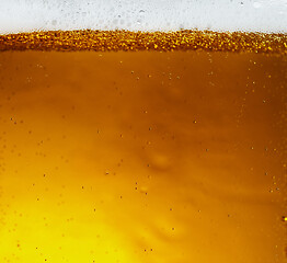 Image showing Close up view of floating bubbles in light beer texture