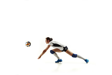 Image showing Young female volleyball player isolated on white studio background