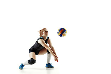 Image showing Young female volleyball player isolated on white studio background