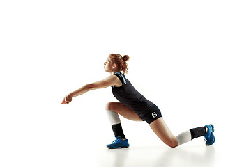 Image showing Young female volleyball player isolated on white studio background