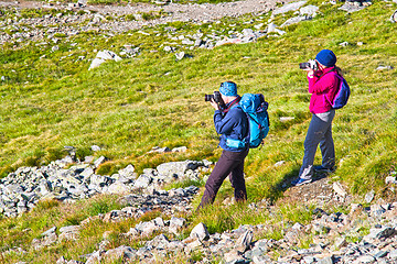 Image showing Young tourists taking photo