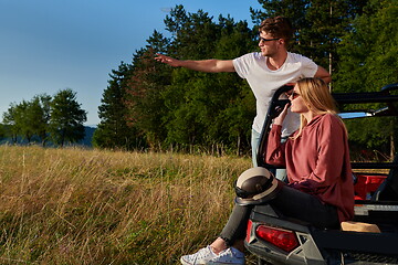 Image showing couple enjoying beautiful sunny day while driving a off road buggy