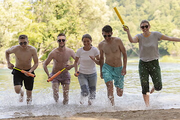 Image showing group of happy friends having fun on river