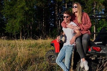 Image showing couple enjoying beautiful sunny day while driving a off road buggy