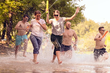 Image showing group of happy friends having fun on river