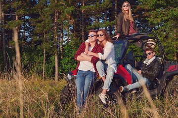 Image showing group young happy people enjoying beautiful sunny day while driving a off road buggy car