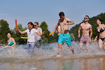 Image showing group of happy friends having fun on river