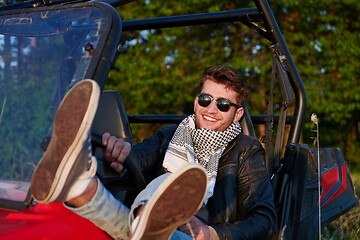 Image showing man enjoying beautiful sunny day while driving a off road buggy car