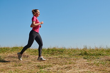 Image showing woman enjoying in a healthy lifestyle while jogging