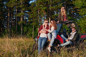 Image showing group young happy people enjoying beautiful sunny day while driving a off road buggy car