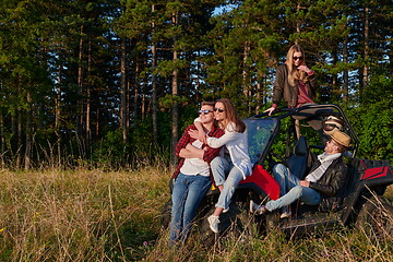 Image showing group young happy people enjoying beautiful sunny day while driving a off road buggy car