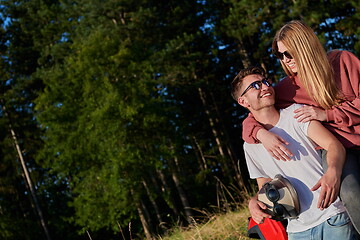 Image showing couple enjoying beautiful sunny day while driving a off road buggy