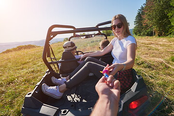 Image showing  colorful torches while driving a off road buggy car