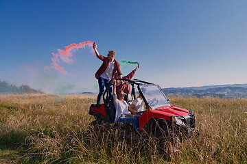 Image showing  colorful torches while driving a off road buggy car