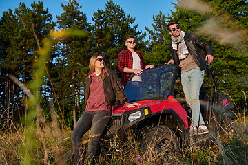 Image showing group young happy people enjoying beautiful sunny day while driving a off road buggy car