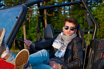 Image showing man enjoying beautiful sunny day while driving a off road buggy car