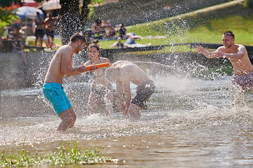 Image showing group of happy friends having fun on river