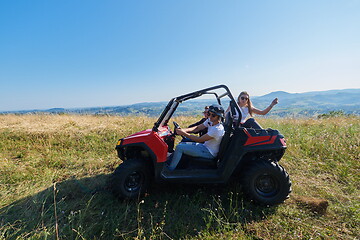 Image showing group young happy people enjoying beautiful sunny day while driving a off road buggy car