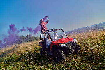 Image showing  colorful torches while driving a off road buggy car