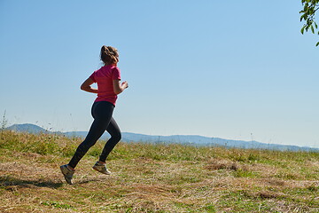 Image showing woman enjoying in a healthy lifestyle while jogging