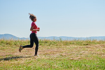 Image showing woman enjoying in a healthy lifestyle while jogging